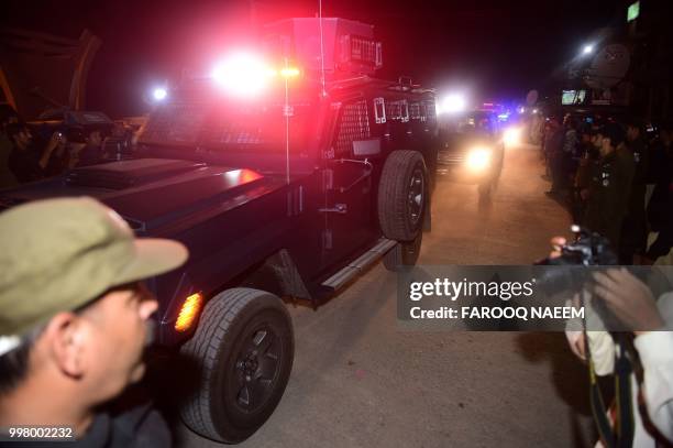 An armoured vehicle allegedly carrying former Pakistan premier Nawaz Sharif and his daughter Maryam Nawaz arrives in Adiala prison in Rawalpindi,...