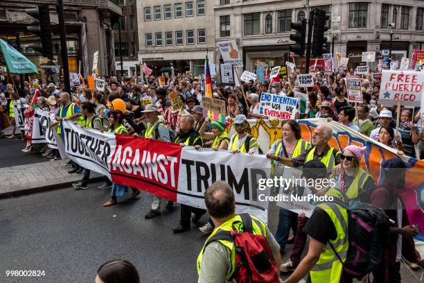 Crowds march on Regent street, London to protest against American president, Donald Trump visit to the UK on 13 of July, 2018. The demonstration...