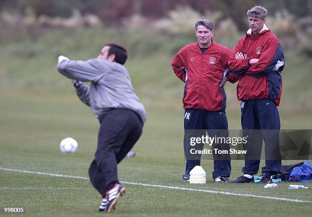 Arsene Wenger the Arsenal coach looks on as Richard Wright makes a save during Arsenals training session at London Colney Training Groung, London....