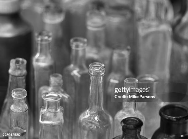 vintage bottles - mike parsons stock pictures, royalty-free photos & images