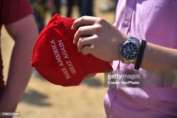 Pro Trump demonstrators holds a cap as a protest takes place in Central London, against the US President Donald Trumps visit to the UK, including a...