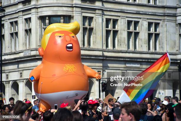 Protest takes place in Central London, against the US President Donald Trumps visit to the UK, including a giant inflatable Baby Trump, London on...