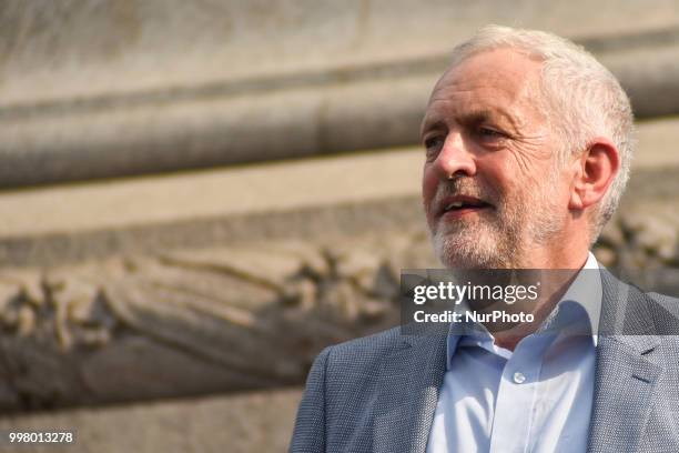 Labour Party leader Jeremy Corbyn gives a speech during a rally against the US President Donald Trumps visit to the UK, including a giant inflatable...