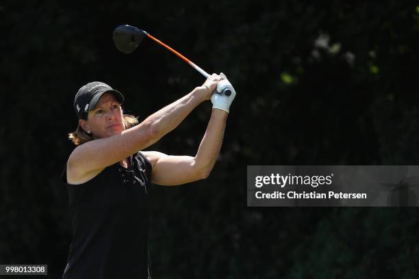 Juli Inkster plays a tee shot on the 14th hole during the second round of the U.S. Senior Women's Open at Chicago Golf Club on July 13, 2018 in...