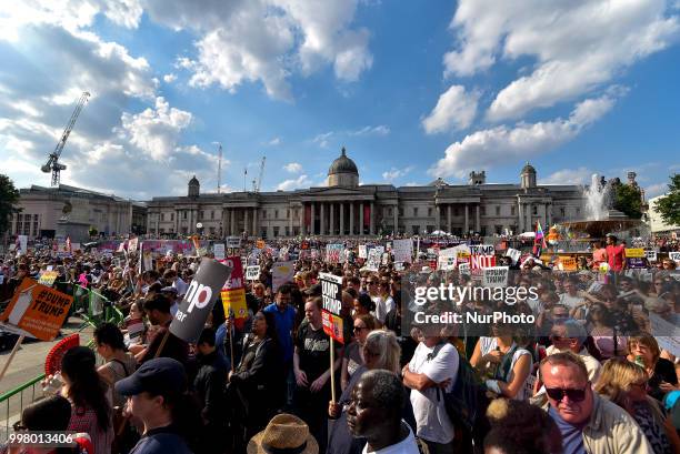 Demonstrators gather at Trafalgar Square as they attend a rally against the US President Donald Trumps visit to the UK, including a giant inflatable...