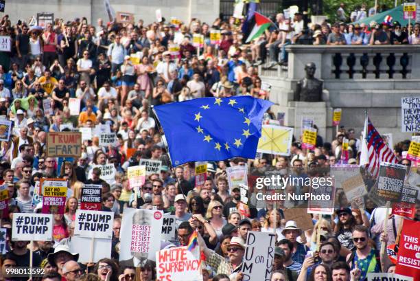 Demonstrators gather at Trafalgar Square as they attend a rally against the US President Donald Trumps visit to the UK, including a giant inflatable...