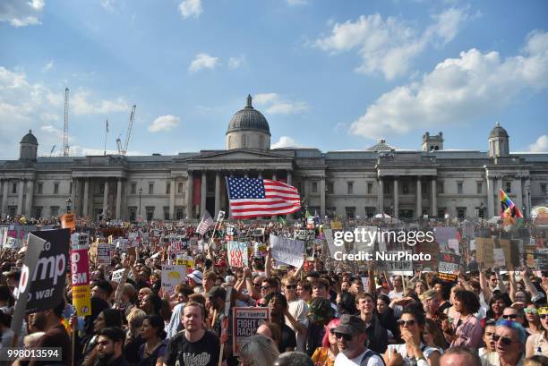 Demonstrators gather at Trafalgar Square as they attend a rally against the US President Donald Trumps visit to the UK, including a giant inflatable...