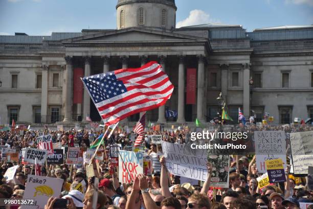 Demonstrators gather at Trafalgar Square as they attend a rally against the US President Donald Trumps visit to the UK, including a giant inflatable...