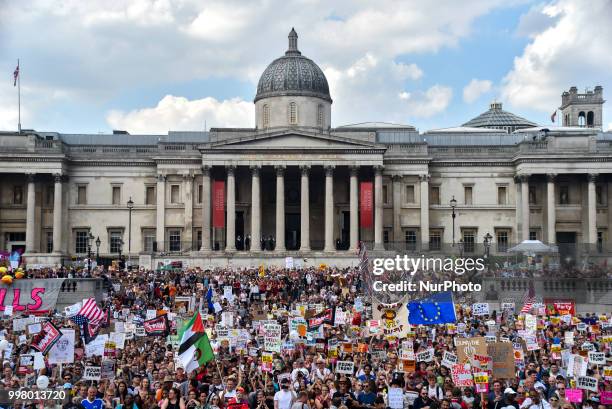 Demonstrators gather at Trafalgar Square as they attend a rally against the US President Donald Trumps visit to the UK, including a giant inflatable...