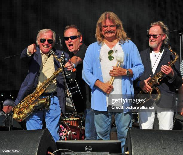 Saxophonist Klaus Doldinger, British singer Nick Van Eede, musician Leslie Mandoki, and saxophonist John Helliwell at the Wings of Freedom concert at...