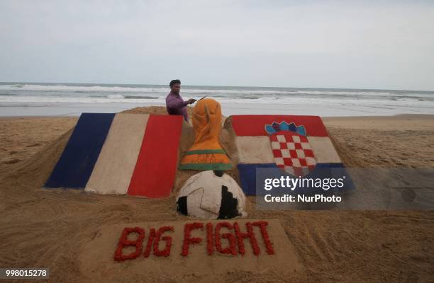 On 13 July 2018, the Indian sand artist Manas Sahoo creates FIFA WOrld Cup 2018 final sand sculpture for visitors attraction at the Bay of Bengal...