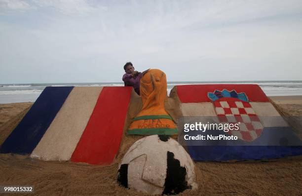 On 13 July 2018, the Indian sand artist Manas Sahoo creates FIFA WOrld Cup 2018 final sand sculpture for visitors attraction at the Bay of Bengal...