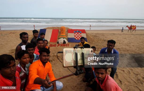 On 13 July 2018, the Indian sand artist Manas Sahoo creates FIFA WOrld Cup 2018 final sand sculpture for visitors attraction at the Bay of Bengal...