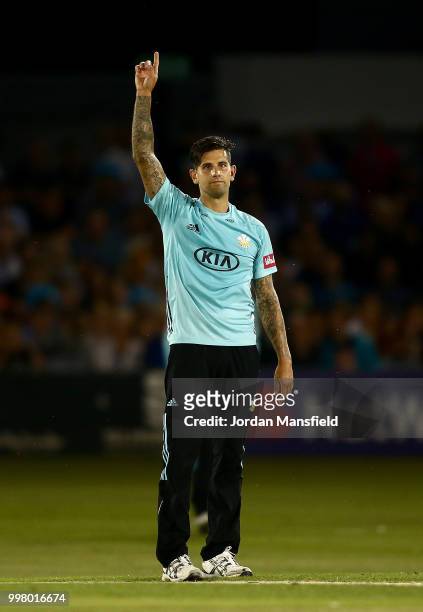 Jade Dernbach of Surrey celebrates taking the final wicket of Danny Briggs of Sussex during the Vitality Blast match between Sussex Sharks and Surrey...