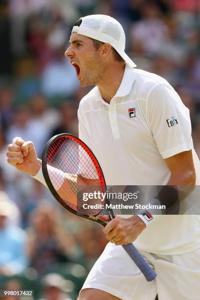 John Isner of The United States celebrates a point against Kevin Anderson of South Africa during their Men's Singles semi-final match on day eleven...