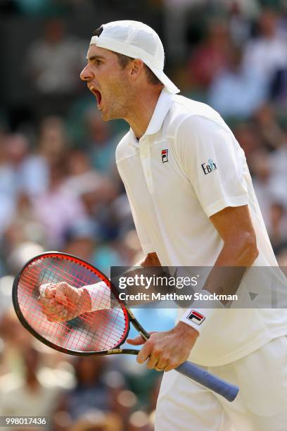 John Isner of The United States celebrates a point against Kevin Anderson of South Africa during their Men's Singles semi-final match on day eleven...