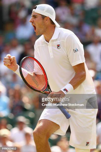 John Isner of The United States celebrates a point against Kevin Anderson of South Africa during their Men's Singles semi-final match on day eleven...
