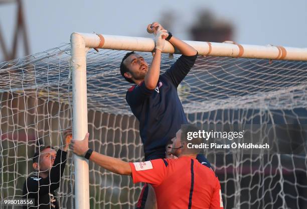 Dublin , Ireland - 13 July 2018; Sligo Rovers physio Declan Brennan fixes the goalnets, as referee Paul McLaughlin looks on during the SSE Airtricity...