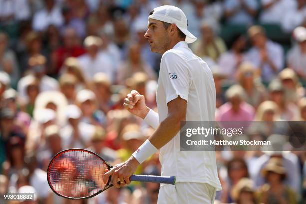 John Isner of The United States celebrates a point against Kevin Anderson of South Africa during their Men's Singles semi-final match on day eleven...