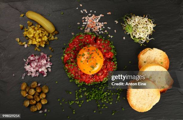 tartare steak of raw minced beef with egg yolk - aine stock-fotos und bilder