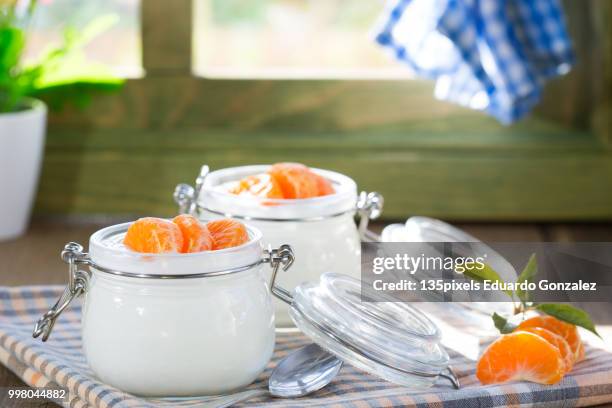 natural yogurt of mandarins - flora gonzalez stock pictures, royalty-free photos & images