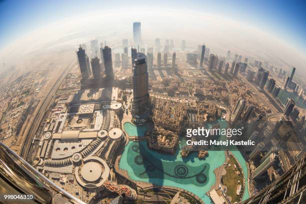 aerial view of downtown dubai from burj khalifa, dubai, united arab emirates. - burj stock-fotos und bilder