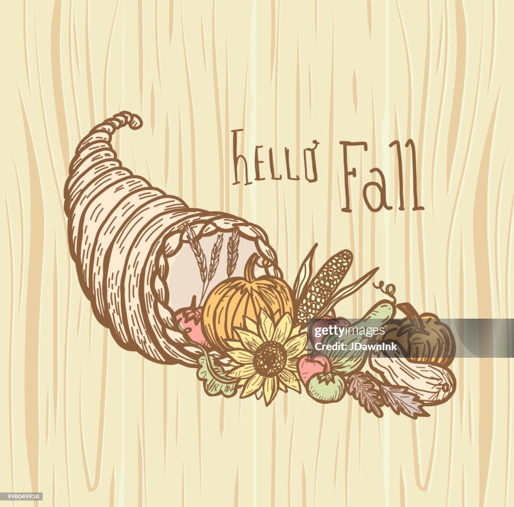 Autumn cornucopia greeting design filled with vegetables and fruit with hand lettered greeting