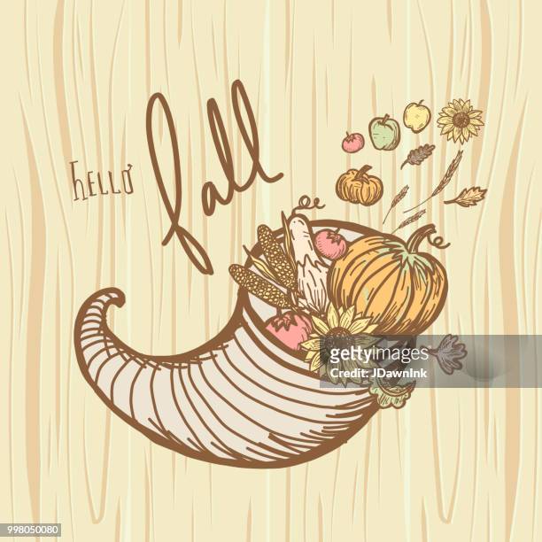 autumn cornucopia greeting design filled with vegetables and fruit with hand lettered greeting - lettered stock illustrations