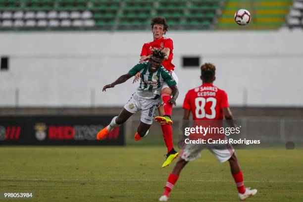 Benfica defender German Conti from Argentina tackles Vitoria Setubal forward Valdu Te from Guinea Bissau during the match between SL Benfica and...