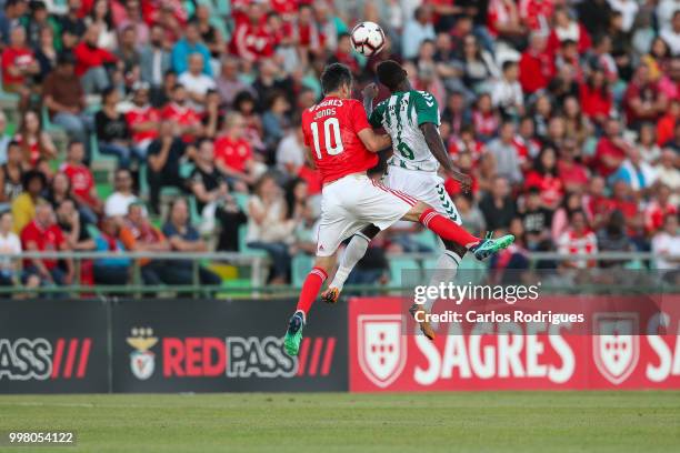 Benfica forward Jonas from Brazil vies with Vitoria Setubal midfielder Jose Semedo from Portugal for the ball possession during the match between SL...