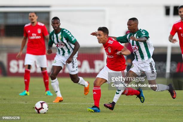 Benfica defender Alex Grimaldo from Spain vies with Vitoria Setubal forward Leandro Resinda from Netherlands for the ball possession during the match...