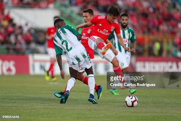Vitoria Setubal defender Mano from Portugal tackles SL Benfica forward Franco Cervi from Argentina during the match between SL Benfica and Vitoria...