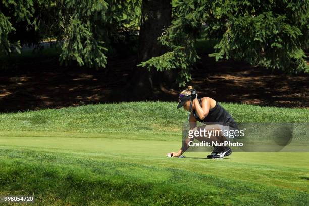 Lexi Thompson of Delray Beach, Florida places her ball on the 8th green during the second round of the Marathon LPGA Classic golf tournament at...