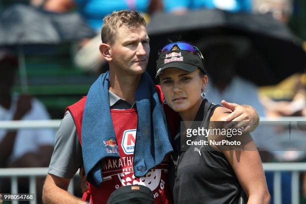 Lexi Thompson of the United States hugs her caddie after finishing the 18th hole during the second round of the Marathon LPGA Classic golf tournament...