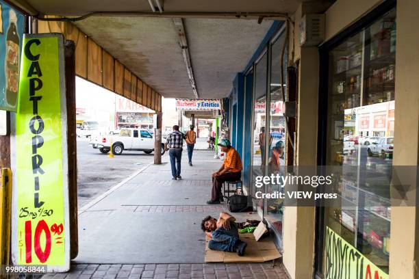 July 10. A homeless person sleeps on the street near Hotel del Migrante on July 10, 2018 in Mexicali, Mexico. Hotel del Migrante is a place that...