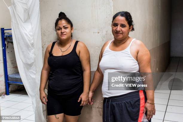 July 10. Mayra Cepeda and Evelyn Lopez from Honduras pose for a portrait at Hotel del Migrante on July 10, 2018 in Mexicali, Mexico. Hotel del...