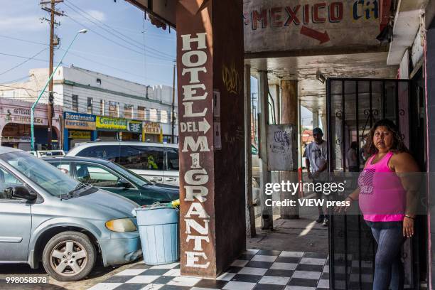 July 10. A woman leaves Hotel del Migrante on July 10, 2018 in Mexicali, Mexico. Hotel del Migrante is a place that offers housing and food to...