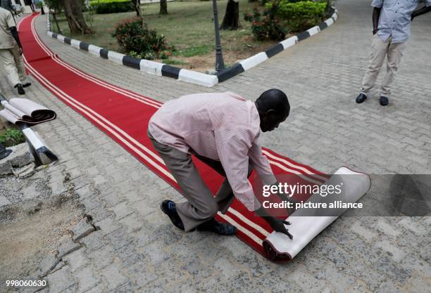 The red carpet being rolled out for German Foreign Minister Sigmar Gabriel at the Presidential Palace in Juba, South Sudan, 10 August 2017. Policy...