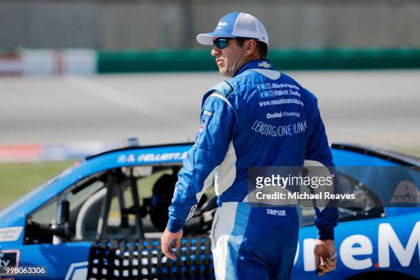 Elliott Sadler, driver of the OneMain Financial Chevrolet, looks on prior to qualifying for the NASCAR Xfinity Series Alsco 300 at Kentucky Speedway...