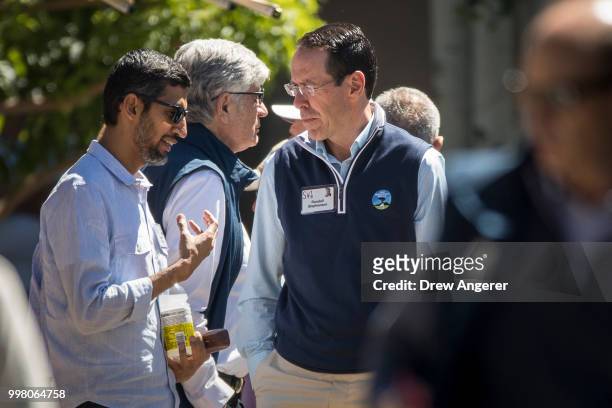 Sundar Pichai, chief executive officer of Google, talks with Randall Stephenson, chief executive officer of AT&T, during the annual Allen & Company...