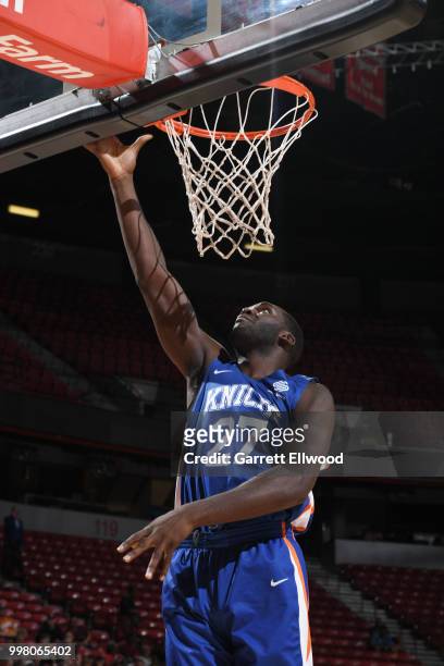 Daniel Ochefu of the New York Knicks drives to the basket during the game against the New Orleans Pelicans during the 2018 Las Vegas Summer League on...
