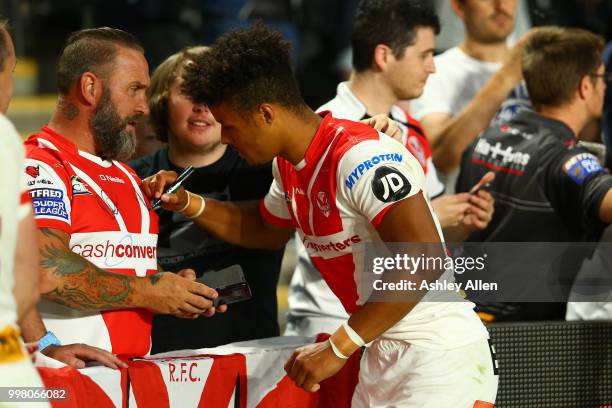 Regan Grace St Helens signs a fans shirt during the BetFred Super League match between Hull FC and St Helens Saints at the KCOM Stadium on July 13,...