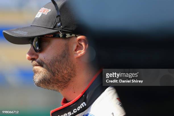 Paul Menard, driver of the Discount Tire Ford, stands on the grid during qualifying for the NASCAR Xfinity Series Alsco 300 at Kentucky Speedway on...