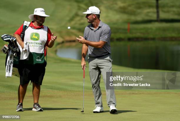 Matt Every tosses the ball to his caddie on the 18th hole during the second round of the John Deere Classic at TPC Deere Run on July 13, 2018 in...