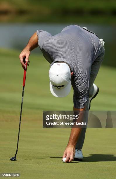 Matt Every marks his ball on the 18th hole during the second round of the John Deere Classic at TPC Deere Run on July 13, 2018 in Silvis, Illinois.