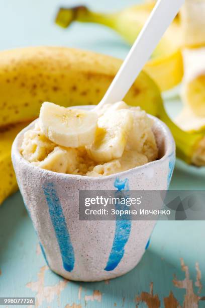 frozen banana in ceramic cup. - mint ice cream stock pictures, royalty-free photos & images
