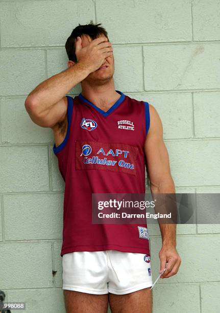 Daniel Bradshaw of the Brisbane Lions shows his disappointment at not being able to train with his team mates during the Brisbane Lions training...