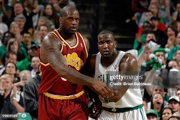 Shaquille O'Neal of the Cleveland Cavaliers and Kendrick Perkins of the Boston Celtics jostle for position in Game Four of the Eastern Conference...