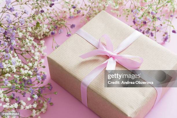 pink background with lilac and white flowers and a present, mother's day concept - white lilac stock pictures, royalty-free photos & images