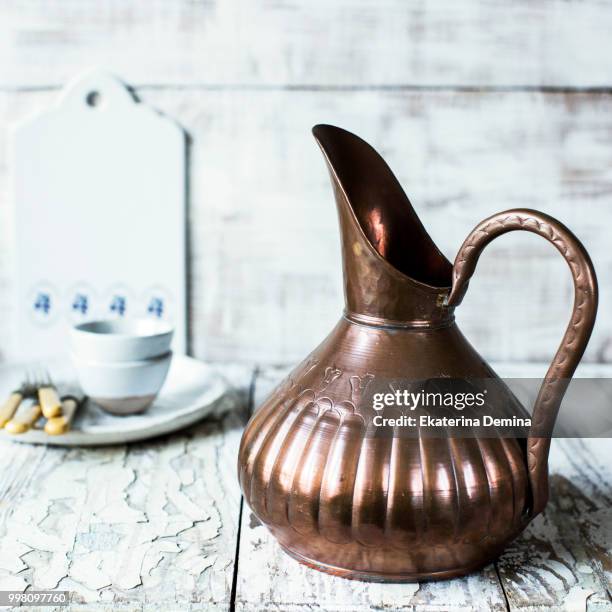 still life with a copper jar - copper still stockfoto's en -beelden